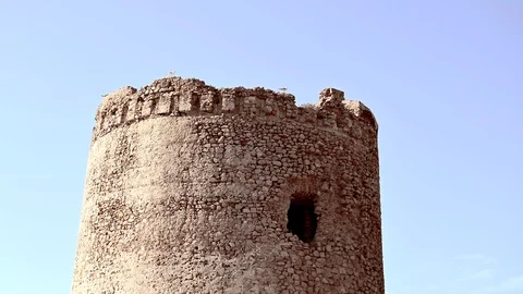 Ruins of an ancient tower of stone nested by birds Stock Footage 110758502