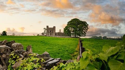 Ruins of Bective Abbey with dramatic sky at sunset. Ireland Stock Photos