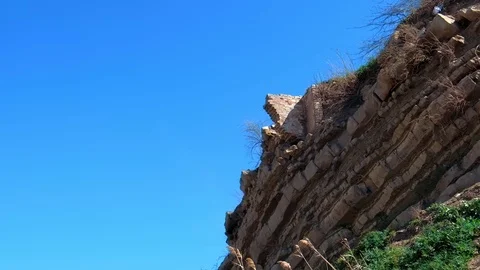 Ruins of brick house in broken rock mountain after earthquake tsunami disaster. Stock Footage 116192584