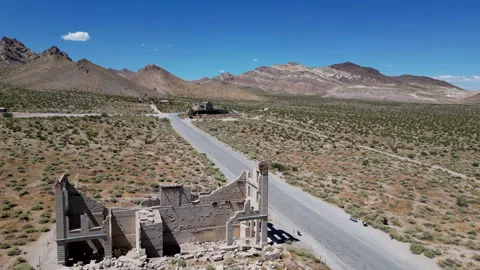 Ruins in desert ghost town called Rhyolite. Aerial view. Nevada, USA. Stock Footage 295649408