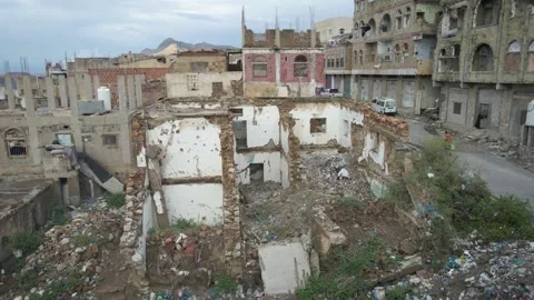 The ruins of the destroyed homes due to the ongoing war in the Yemeni Stock Footage 158504750