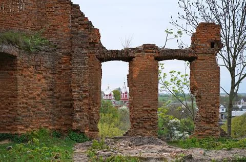 Ruins of expressive red brick gate tower of ancient castle in Korets, Ukraine Stock Photos