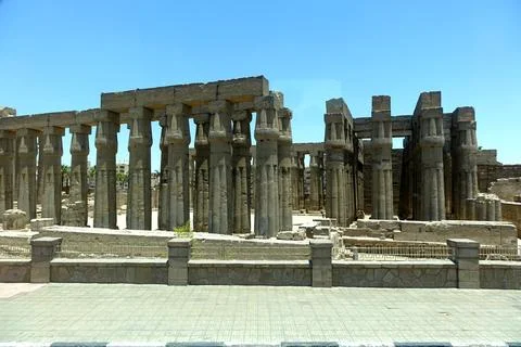 Ruins of Luxor Temple Featuring a Colonnade and Ancient Statues Viewed From.. Stock Photos