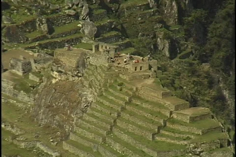 The ruins of Machu Picchu rest against in a steep mountain hillside in Peru. Stock Footage