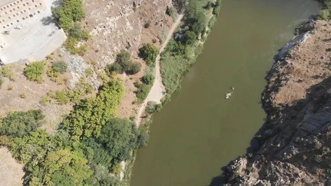 The ruins of an old bridge in the riverbed. View from the drone. Stock Footage 116617245
