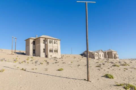 Ruins of once prosperous German mining town Kolmanskop in the Namib desert near Stock Photos