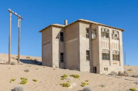 Ruins of once prosperous German mining town Kolmanskop in the Namib desert near Stock Photos