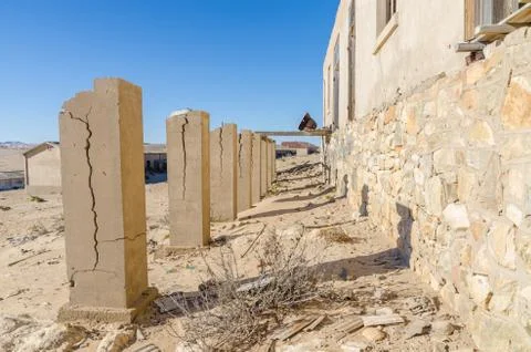 Ruins of once prosperous German mining town Kolmanskop in the Namib desert near Stock Photos