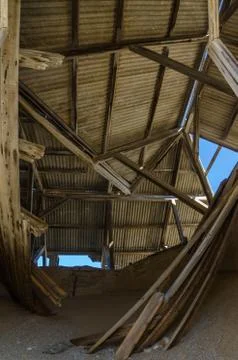 Ruins of once prosperous German mining town Kolmanskop in the Namib desert near Stock Photos