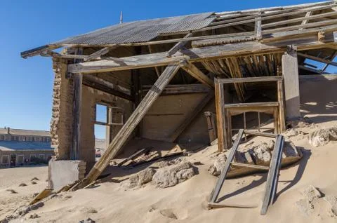 Ruins of once prosperous German mining town Kolmanskop in the Namib desert near Stock Photos