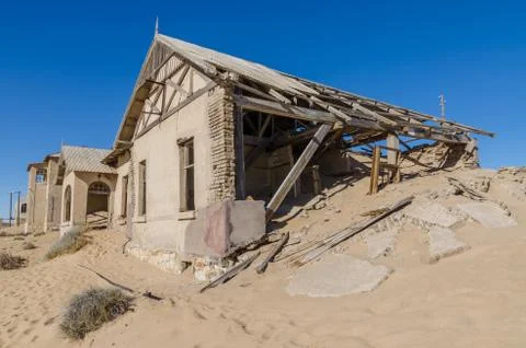 Ruins of once prosperous German mining town Kolmanskop in the Namib desert near Stock Photos