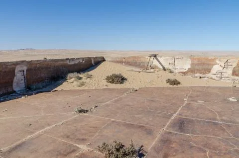 Ruins of once prosperous German mining town Kolmanskop in the Namib desert near Stock Photos