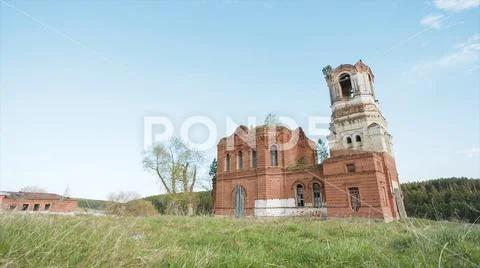 Ruins of one abandoned church from red bricks in Russia. Video. Outdoor on field Stock Photos