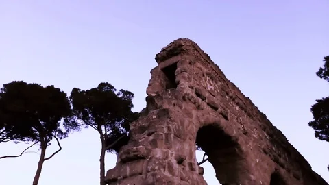 Ruins of Roman acqueduct at sunset Stock Footage