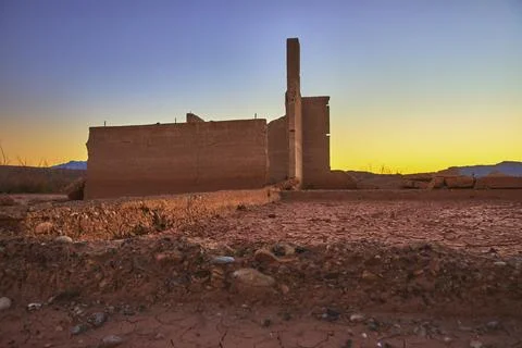 Ruins of St Thomas Ghost Town at Golden Hour with Cracked Earth and Desert .. Stock Photos