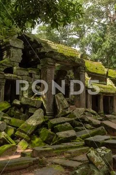 Ruins of temple entrance with fallen rocks Stock Photos