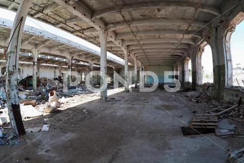 Ruins, view of an old abandoned industrial interior Stock Photos