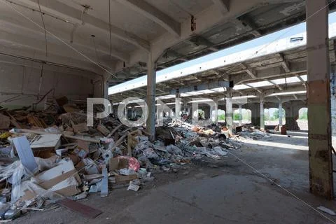 Ruins, view of an old abandoned industrial interior Stock Photos