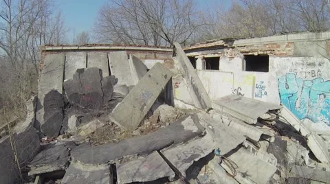 Ruins of workshop edifice with graffiti on wall. Aerial view Stock Footage 41763228
