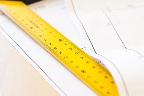 Ruler and drawings on the table Stock Photos