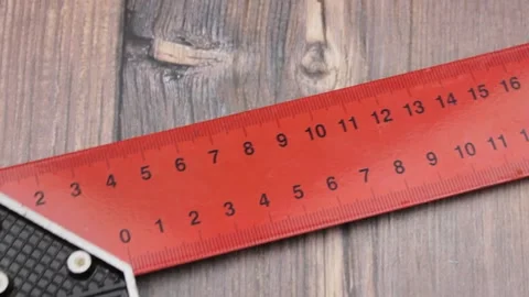 The ruler is metallic red. The red ruler is centimeters. Ruler inches. Stock Footage 171927225