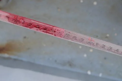 Ruler tape with indicator color paste for diesel oil Stock-Fotos