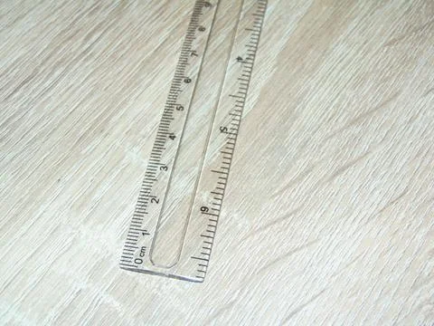 Ruler on a wooden table Photos