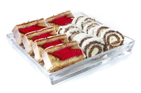 Rum-tea and coconut sweets on glass plate Stock Photos