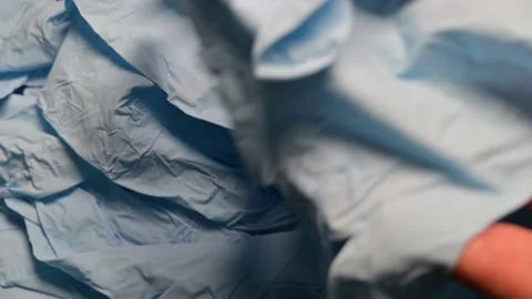 Rummage through many latex gloves Stock Footage 141289024