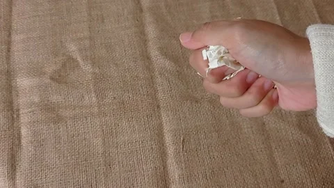 Rumple the paper with one hand Stock Footage 151022653