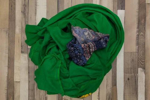 Rumpled clothes on the floor. Stock Photos