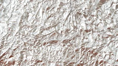 Rumpled foil texture background silver Stock Photos