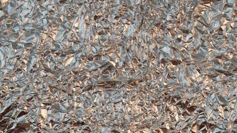 Rumpled foil texture background silver Stock Photos