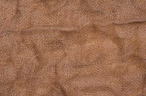 Rumpled rustic sackcloth background. Vintage rustic texture Stock Photos