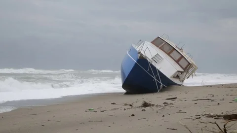 Run aground ship on the beach near the sea Stock Footage 71170409