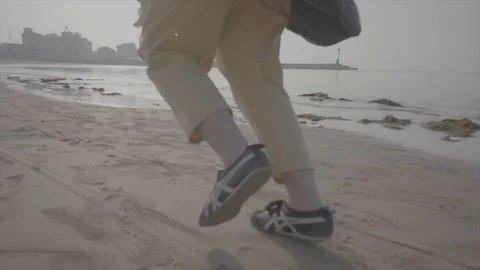 Run on the beach in Jeju Island Stock Footage