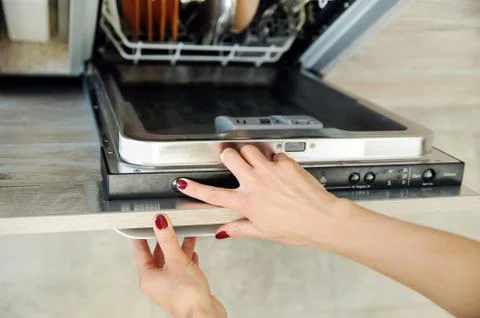 Run the dishwashing machine. Stock Photos