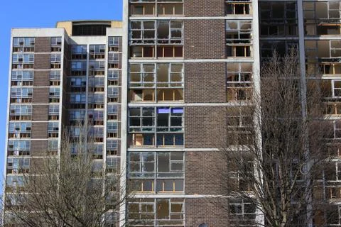 Run down urban housing with smashed windows ready for demolition Stock Photos