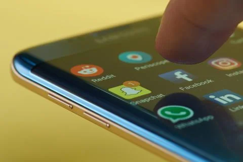 Run facebook application on smartphone Stock Photos