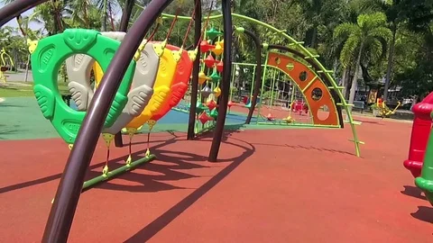 Run to the playground in public park at sunny day. Stock Footage 75394591