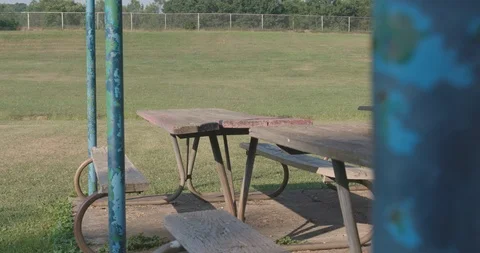 Rundown Picnic Table Area In Empty Playground Vídeos de archivo 92334904