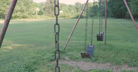 Rundown Swingset In Empty Playground Vídeos de archivo 92338457