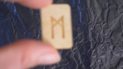 Rune. close-up, hand puts the rune on the surface for divination. 4k, slow Stock Footage 88059635