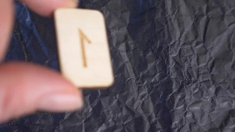 Rune. close-up, hand puts the rune on the surface for divination. 4k, slow Stock Footage 88060316