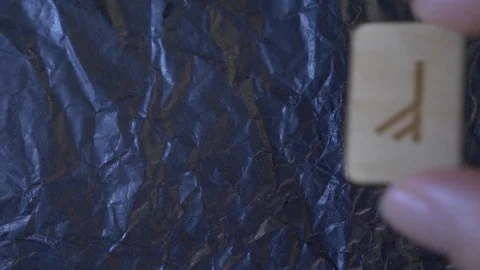 Rune. close-up, hand puts the rune on the surface for divination. 4k, slow Stock Footage 88060401