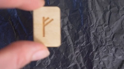 Rune. close-up, hand puts the rune on the surface for divination. 4k, slow Stock Footage 88060988