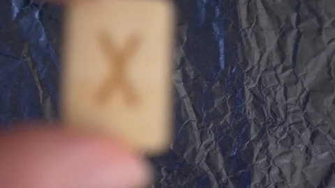 Rune. close-up, hand puts the rune on the surface for divination. 4k, slow Stock Footage 88061127