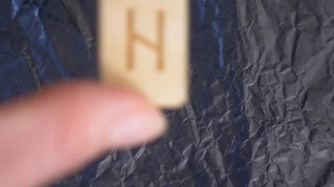 Rune. close-up, hand puts the rune on the surface for divination. 4k, slow Stock Footage 88061159