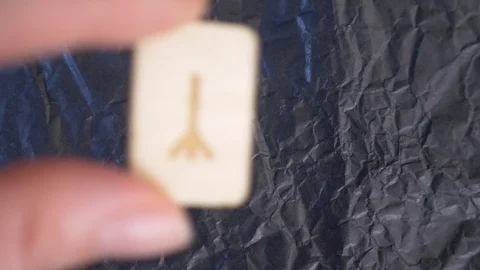 Rune. close-up, hand puts the rune on the surface for divination. 4k, slow Stock Footage 88061358