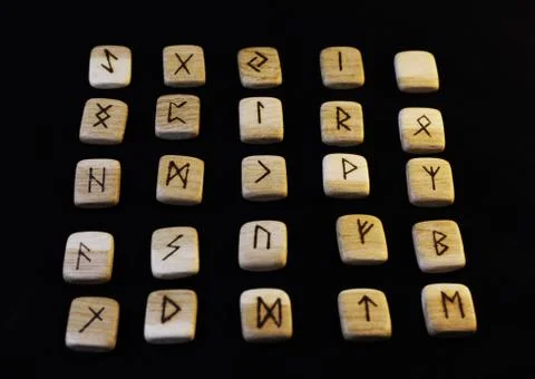 Runes on black background. Stock Photos